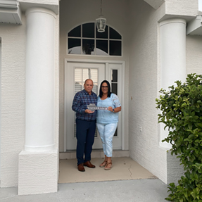 HEA, Sergio and Celia in front of their home