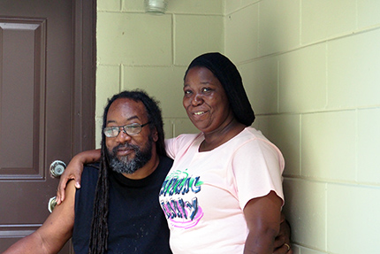 PASF couple on the exterior of their home